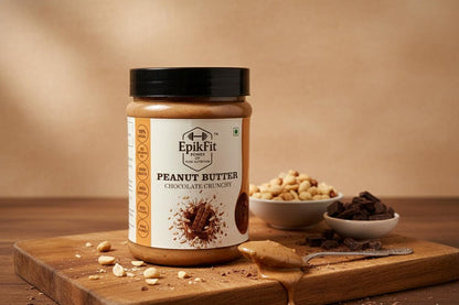 Jar of EpikFit Peanut Butter on a wooden cutting board with ingredients in the background