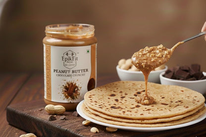EpikFit Peanut Butter jar with a spoonful of peanut butter being spread on a tortilla.